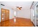 Bedroom with hardwood floors, a ceiling fan, and a door to the outside at 1000 Chesterfield Cir, Winter Springs, FL 32708