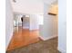 Open-concept hallway with tile flooring, hardwood floors, and views to the living room and kitchen at 1000 Chesterfield Cir, Winter Springs, FL 32708