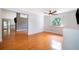 A cozy living room boasts hardwood floors, a ceiling fan, and ample natural light at 1000 Chesterfield Cir, Winter Springs, FL 32708