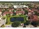 Townhome complex with lush green space and serene pond at 12106 Poppy Field Ln # 107, Orlando, FL 32837