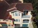 Charming townhome featuring a private balcony, neutral exterior paint, and convenient garage access at 12106 Poppy Field Ln # 107, Orlando, FL 32837