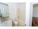 Bathroom featuring a vanity, toilet, and tiled bathtub at 12106 Poppy Field Ln # 107, Orlando, FL 32837