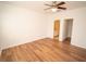 Bedroom featuring neutral walls, hardwood floors, and ceiling fan at 12106 Poppy Field Ln # 107, Orlando, FL 32837
