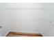 Walk-in closet featuring hardwood floors and a white shelving system at 12106 Poppy Field Ln # 107, Orlando, FL 32837