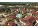 Aerial view of the community features a sparkling pool, lush landscaping, and well-maintained townhomes at 12106 Poppy Field Ln # 107, Orlando, FL 32837