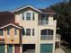 Townhome showcases a private balcony, large windows, and attached garage, offering comfort and convenience at 12106 Poppy Field Ln # 107, Orlando, FL 32837