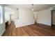 An open-concept living room with hardwood floors and neutral walls at 12106 Poppy Field Ln # 107, Orlando, FL 32837