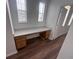 Dedicated home office space with built-in desk, cabinets, and natural light at 12106 Poppy Field Ln # 107, Orlando, FL 32837