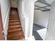 Inviting interior featuring hardwood staircase leading to a spacious, bright garage area at 12106 Poppy Field Ln # 107, Orlando, FL 32837