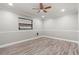Bright, empty bedroom with modern laminate flooring and neutral paint at 126 Duncan Trl, Longwood, FL 32779