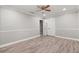 Spacious bedroom with laminate flooring, closet, and access to bathroom at 126 Duncan Trl, Longwood, FL 32779