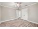 Bedroom with closet and neutral paint, updated floor, and ceiling fan at 126 Duncan Trl, Longwood, FL 32779