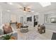 Inviting living room featuring neutral decor, tiled floors, and a view into the adjacent kitchen at 126 Duncan Trl, Longwood, FL 32779