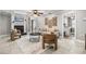 Inviting living room with a fireplace, stylish decor, and a view into the adjacent laundry room at 126 Duncan Trl, Longwood, FL 32779