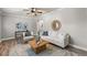 Bright living room with neutral colors, hardwood floors, a wood coffee table, and stylish furnishings at 126 Duncan Trl, Longwood, FL 32779