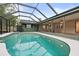 Screened-in pool area with view of house at 126 Duncan Trl, Longwood, FL 32779
