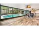Relaxing enclosed pool area with comfortable seating and a view of the pool at 126 Duncan Trl, Longwood, FL 32779