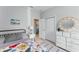 Bright bedroom with floral bedding, modern dresser, and neutral decor offers a tranquil retreat at 13227 Spring Grove Way, Winter Garden, FL 34787