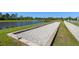 Bocce ball court near pond for outdoor community recreation at 13227 Spring Grove Way, Winter Garden, FL 34787