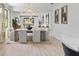Elegant dining room with modern chandelier, neutral color scheme, and open access to living area at 13227 Spring Grove Way, Winter Garden, FL 34787