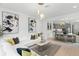Bright, open-concept living room featuring modern lighting, stylish decor, and seamless flow to the dining area at 13227 Spring Grove Way, Winter Garden, FL 34787