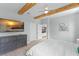 Spacious main bedroom highlighting exposed beams, ensuite bath, and easy access to living areas at 13227 Spring Grove Way, Winter Garden, FL 34787