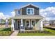 Charming two-story home with a covered front porch and well-maintained landscaping at 1341 Lumpini St, St Cloud, FL 34771