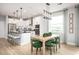 Bright and airy kitchen and dining area with a modern design, stainless appliances, and large windows at 1341 Lumpini St, St Cloud, FL 34771