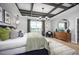 Serene main bedroom with tray ceiling, pendant lights, and large windows at 1341 Lumpini St, St Cloud, FL 34771