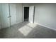 Neutral bedroom features carpet flooring, ample closet space, and abundant natural light at 1354 Twelve Oaks Rd, St Cloud, FL 34771