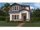 Charming two-story home features a combination of stone and vertical siding accents at 1354 Twelve Oaks Rd, St Cloud, FL 34771