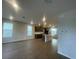 Spacious living area showcasing hardwood flooring, recessed lighting, and modern open layout at 1354 Twelve Oaks Rd, St Cloud, FL 34771