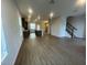 Open-concept living room featuring modern flooring, abundant natural light, and neutral wall tones at 1354 Twelve Oaks Rd, St Cloud, FL 34771