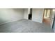 Large bedroom with neutral carpet, en suite bathroom, and ample natural light at 1354 Twelve Oaks Rd, St Cloud, FL 34771