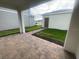 View of the brick-paved patio and green lawn at 1354 Twelve Oaks Rd, St Cloud, FL 34771