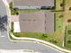 An overhead view of a charming house highlighting the lush garden, well-kept lawn, and neighborhood at 1382 Foltz Loop, Oakland, FL 34787
