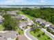 Scenic aerial view of a residential area with lake views and mature trees at 1382 Foltz Loop, Oakland, FL 34787