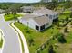 A gorgeous backyard with a lush lawn and manicured landscaping offers serene views at 1382 Foltz Loop, Oakland, FL 34787