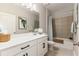 Modern bathroom with white cabinets, sleek hardware, and a shower-tub combination at 1382 Foltz Loop, Oakland, FL 34787