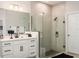 Modern bathroom featuring a glass-enclosed shower and sleek vanity at 1382 Foltz Loop, Oakland, FL 34787