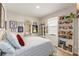 Cozy bedroom with charming decor, featuring a comfortable bed and whimsical display shelves at 1382 Foltz Loop, Oakland, FL 34787