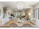 Open dining area with wood table, decorative chandelier, and seamless access to the living room at 1382 Foltz Loop, Oakland, FL 34787