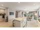 Bright kitchen with an island overlooking the dining area and living room at 1382 Foltz Loop, Oakland, FL 34787