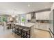 Open-concept kitchen featuring a large kitchen island and views of the dining and living area at 1382 Foltz Loop, Oakland, FL 34787