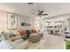 Inviting living room seamlessly connects to the dining area and modern kitchen with bright interiors at 1382 Foltz Loop, Oakland, FL 34787