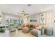 Comfortable living room with neutral tones, leading to a screened patio, perfect for relaxation at 1382 Foltz Loop, Oakland, FL 34787