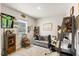 Functional office space with a gray sofa, work desk and bike-themed decor, providing an inspiring environment at 1382 Foltz Loop, Oakland, FL 34787