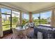 An airy screened patio features comfortable seating, a dining table, and a relaxing spa at 1382 Foltz Loop, Oakland, FL 34787