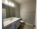 Well-lit bathroom with a modern vanity, mirror, and essential fixtures for a comfortable experience at 1411 Mount Royal Dr, St Cloud, FL 34771