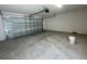 Spacious garage with a large door and opener, offering ample room for vehicles and storage at 1411 Mount Royal Dr, St Cloud, FL 34771
